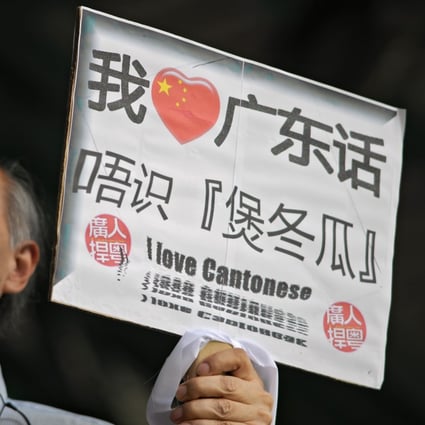 A man carries a sign saying: “I love Cantonese”. With more than 80 million speakers globally, it remains a vital and useful language. Photo: AFP