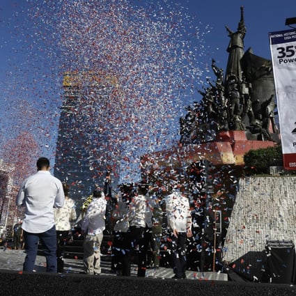 Confetti is showered from above during a ceremony to mark the 35th anniversary of the People Power Revolution at the People Power Monument in Quezon City Philippines, on February 25. Photo: EPA-EFE