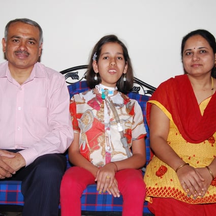 Prassana Shirol (left), his wife Sharadha and their daughter Nidhi (centre). His daughter’s hours-long treatments for a rare, lifelong disease led to Shirol setting up rare disease centres in public and private hospitals in India. Photo: courtesy of the Shirol family