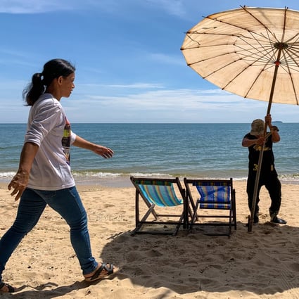 Staff set up a beach umbrella and chairs at a resort as they await the arrival of tourists in Rayong province in eastern Thailand. Photo: AFP