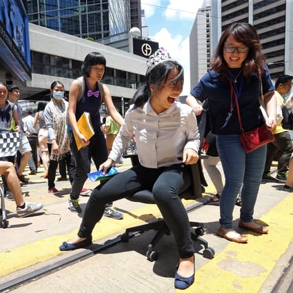 Campaigners from a non-profit group take part in an event in Hong Kong’s Central district in June 2016, to raise awareness of air pollution and call for pedestrianisation. Photo: Dickson Lee