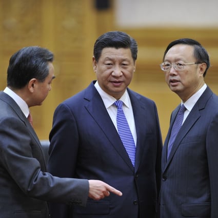 Chinese Foreign Minister Wang Yi (left) and State Councillor Yang Jiechi (right) with President Xi Jinping before a meeting at the Great Hall of the People in 2014. Beijing’s willingness to plunge into what will surely be tough discussions so soon after the NPC meetings should be celebrated. Photo: Getty Images
