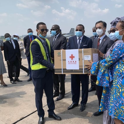 Senior Congolese officials pose for a photo with Chinese Ambassador to the Republic of Congo Ma Fulin at the airport in the capital Brazzaville on March 10, when the first batch of Covid-19 vaccines donated by the Chinese government arrived. Photo: Xinhua