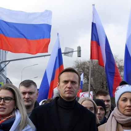 Russian opposition leader Alexei Navalny (centre) marches in Moscow on February 29, 2020. Bellingcat was part of a joint investigation into Navalny’s poisoning. Photo: AFP
