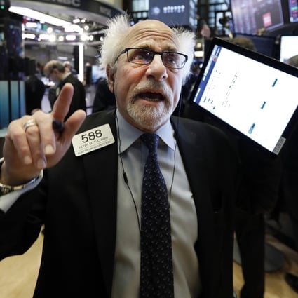 A trader on the floor of the the New York Stock Exchange on January 27, 2020. Global market capitalisation now exceeds global GDP. Photo: AP