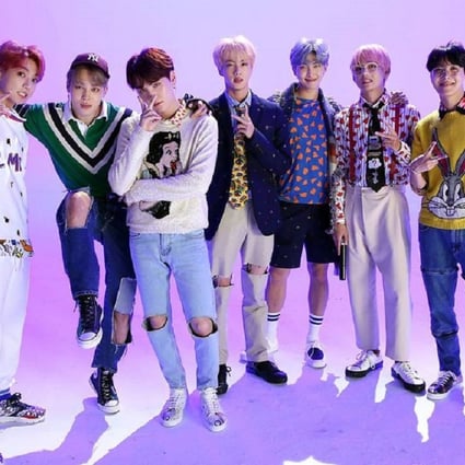 K-pop boy band BTS were depicted on a Topps trading card beaten and bruised. Commenters online called the depictiion violent and racist, and the company withdrew the card and apologised. Photo: Big Hit Entertainment