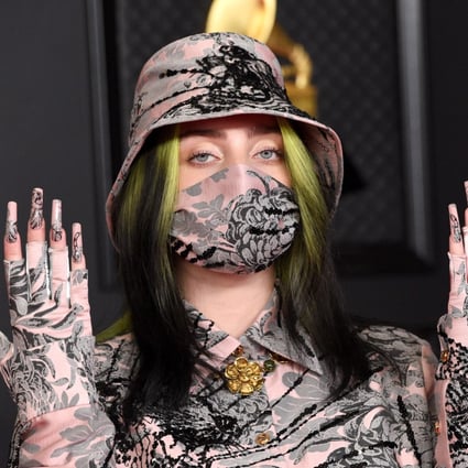 Billie Eilish covered up at the Grammy Awards and some have wondered if she was hiding her new blonde locks under a wig. Photo: EPA