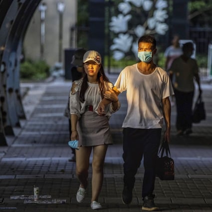 A couple walk through the People’s Park in Shanghai, China, on August 9, 2020. Photo: EPA-EFE
