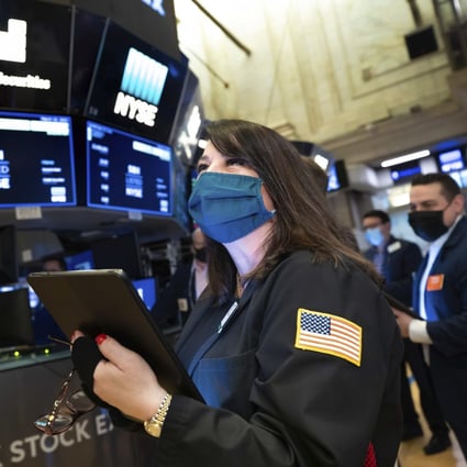 A trader works on the floor of the New York Stock Exchange on March 10 when stability in the bond market translated into gains for stocks. Photo: AP