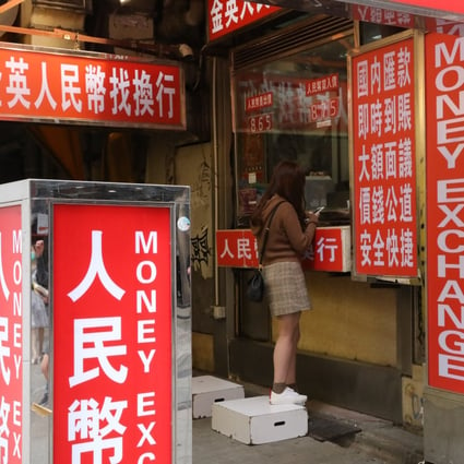 Light boxes showing renminbi (yuan) currency available outside a money changer’s shop in Kwai Chung in Hong Kong on October 15, 2020. Photo: K.Y. Cheng 