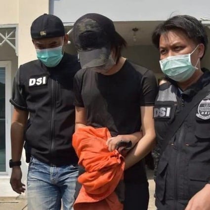 Thai police arrest Danudetch. Photo: DSI
