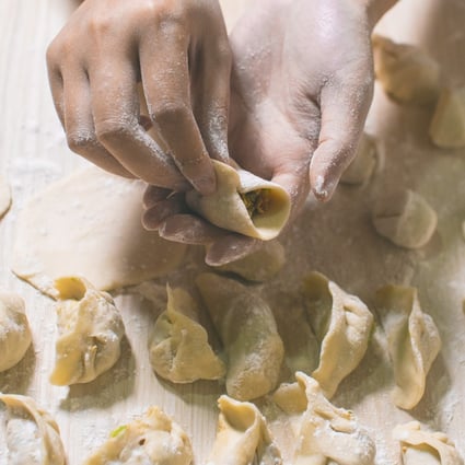 A woman makes dumplings. A food eaten from Western Europe to Siberia and China, the dumpling’s origin is thought to lie in the Middle East. Photo: Getty Images/iStockphoto