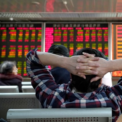 An investor looks at a stock quotation board at a brokerage office in Beijing, China January 3, 2020. Photo: Reuters