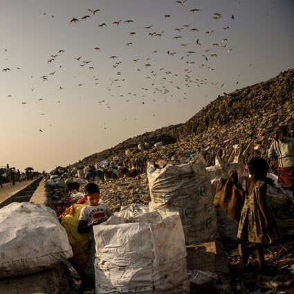 Child scavengers look for recyclable material at a landfill on the outskirts of Gauhati, India, on February 4. Photo: AP