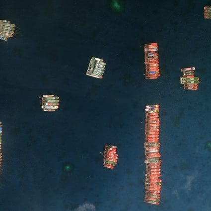 Satellite images showing the flotilla of Chinese ships near Whitsun Reef. Photo: Maxar Technologies via AP