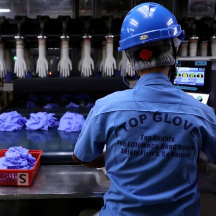 An employee works at a production line in Top Glove factory in Shah Alam, Malaysia. File photo: Reuters
