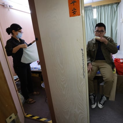 Yau Tsim Mong district councillors Suzanne Wu Sui-shan  and Isaac Ho Cheuk-hin attend a simulation of sub-divided flats in Hong Kong on March 14. Photo: Dickson Lee