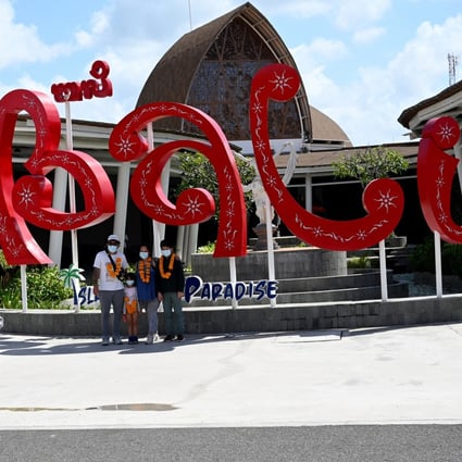 Domestic tourists arrive at Bali airport last July. Photo: AFP