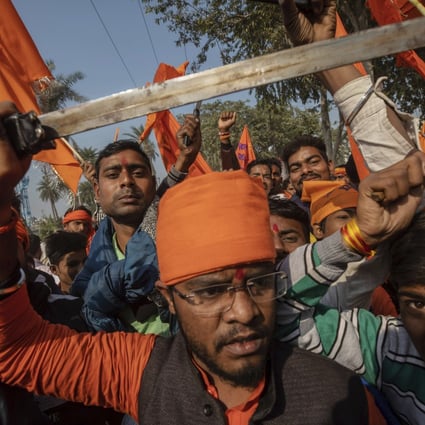 Hindu hardliners, one brandishing a sword, chant slogans against Muslim communities during a rally in 2018 in Uttar Pradesh. Photo: AP