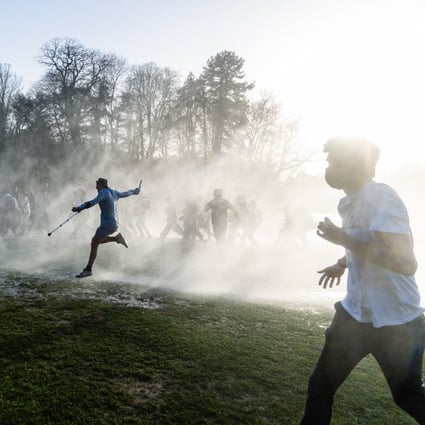 Party-goers in Brussels, Belgium, run from water cannon fired by police to disperse a large crowd gathering for a festival in the Bois de la Cambre park. Photo: ZUMA Wire / DPA
