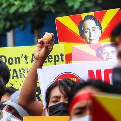 A protester holds up an egg during an Easter protest calling for the return of civilian rule in Myanmar. Photo: AFP