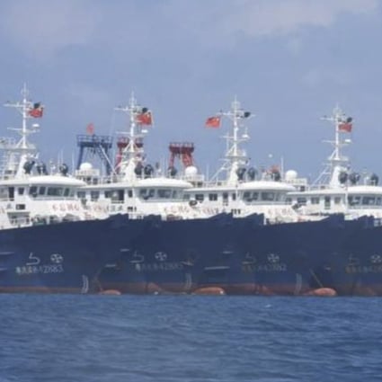 In this March 7, 2021, photo some of the 220 Chinese vessels are seen moored at Whitsun Reef in the South China Sea. The Philippine government expressed concern after spotting more than 200 Chinese fishing vessels. Photo: Photo: Philippine Coast Guard/National Task Force-West Philippine Sea via AP
