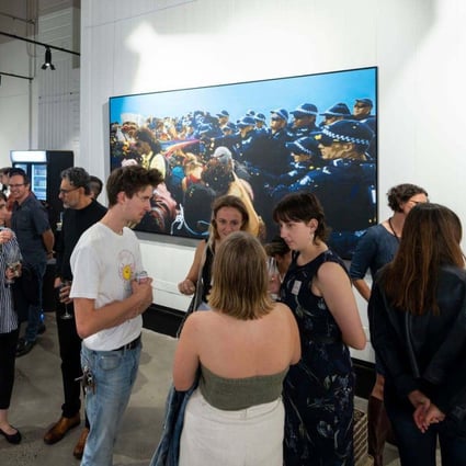 Visitors at an aMBUSH Gallery exhibition in Canberra on March 11, 2021. Photo: Facebook/aMBUSH Gallery