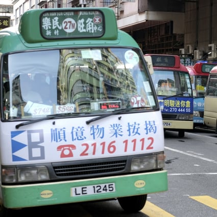 Green and red minibuses wait in traffic in Mong Kok. Hong Kong’s Smart Traffic Fund could be used to offer customised bus services in the city. Photo: Fung Chang