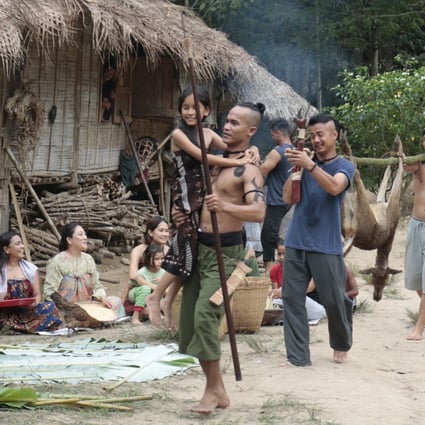 Actor Pablo Amirul (front) plays Gadang, whose longhouse is threatened by zombies in the film Belaban Hidup: Infeksi Zombie.