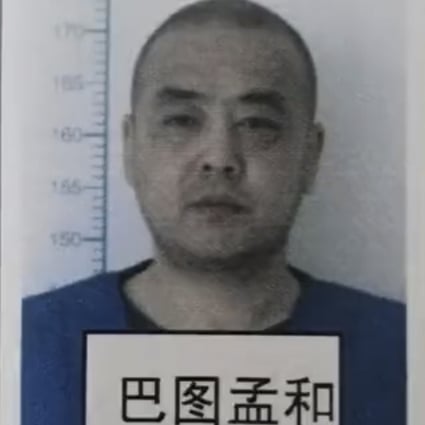 Police mug shot of criminal Batu Menghe. Officials who let the convicted murderer walk free just months into a 15-year sentence have now been punished. Photo: Handout
