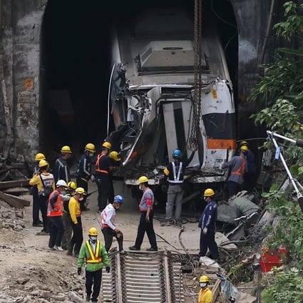 Rescue workers pull a train carriage from the tunnel in Hualien on Tuesday after the deadly crash. Photo: Reuters