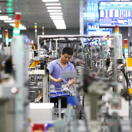 A worker is seen at the microwave oven factory of home appliances giant Midea Group in Foshan, a city in southern China’s Guangdong province, on April 1, 2021. Photo: Xinhua