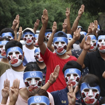 Demonstrators flash the three-finger salute during an anti-coup mask strike in Yangon on April 4. Photo: AP