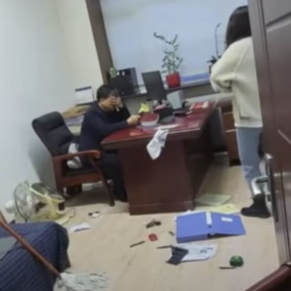A government official (left) was fired after he was accused of sexual harassment by a woman who eventually beat him with a mop. Credit: Youtube