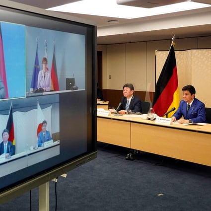 Japan’s Foreign Minister Toshimitsu Motegi and Defence Minister Nobuo Kishi, right, attend a video conference with German Foreign Minister Heiko Maas and Defence Minister Annegret Kramp-Karrenbauer on Tuesday. Photo: Pool via AFP