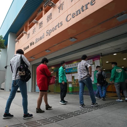 People queue up for Covid-19 vaccines at the Sha Tin community vaccination centre in Sha Tin Yuen Wo Road Sports Centre on March 27. Photo: Felix Wong