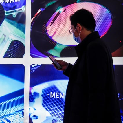 A man views a display at the SEMICON China trade fair in Shanghai, China March 17, 2021. Photo: Reuters