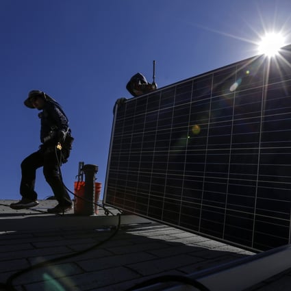 A crew installs a solar system on a home. Photo: TNS