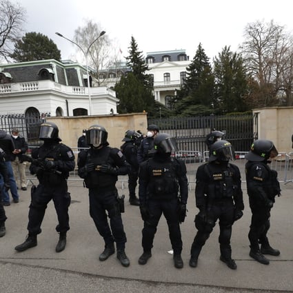 Riot police guard the area as protesters gather in front of the Russian Embassy in Prague, Czech Republic, on Sunday. Photo: AP