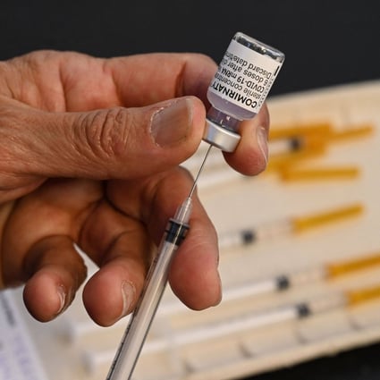 A nurse prepares a dose of the Pfizer/BioNTech vaccine against Covid-19 at a vaccination centre. Photo: AFP