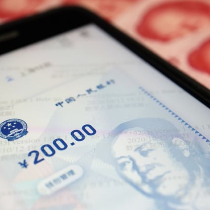 China’s official app for digital yuan seen on a mobile phone next to 100-yuan banknotes in this illustration picture taken October 16, 2020. The People’s Bank of China is making moves to strengthen its financial technology, including a “central bank cloud”. Photo: Reuters