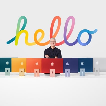 Apple CEO Tim Cook with the all-new iMac lineup announced during a special event at Apple Park in Cupertino, California, US, on April 20, 2021. Photo: Handout
