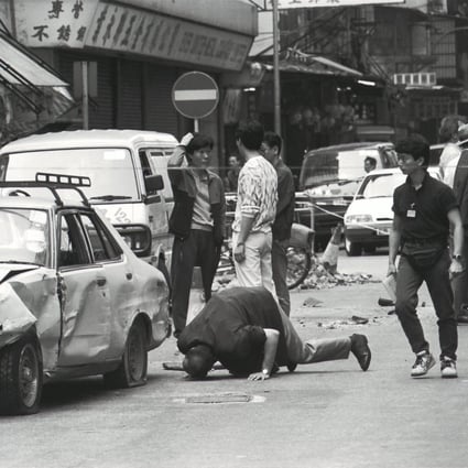 Police inspect a car crashed into by a taxi hijacked by armed men in Tai Kok Tsui, in 1992. Photo: SCMP