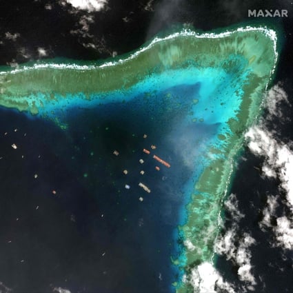 Satellite imagery taken on March 23, 2021,  by  Maxar Technologies shows Chinese vessels anchored at the Whitsun Reef, around 320km (175 nautical miles) west of Bataraza in Palawan in the South China Sea.Photo: 2021 Maxar Technologies/AFP