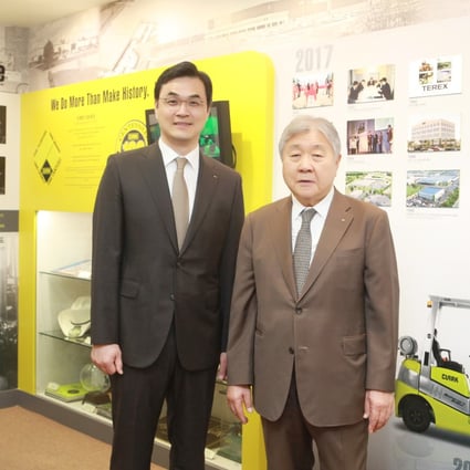 From left, Baik Seung-soo, CEO and vice-chairman of CLARK Material Handling International, and Baik Sung-hak, founder of Young An Hat and chairman of CLARK Material Handling International