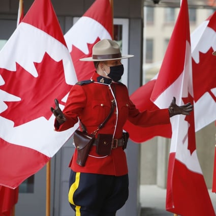 Royal Canadian Mounted Police officers wearing masks stand outside the Senate of Canada in Ottawa, Ontario, in September 2020. Many police forces in Ontario have resisted a re-introduction of street checks to combat Covid-19. Photo: Bloomberg 