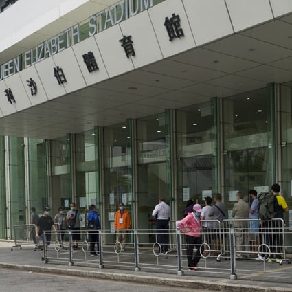 People queue outside a Hong Kong vaccination centre. Photo: AP