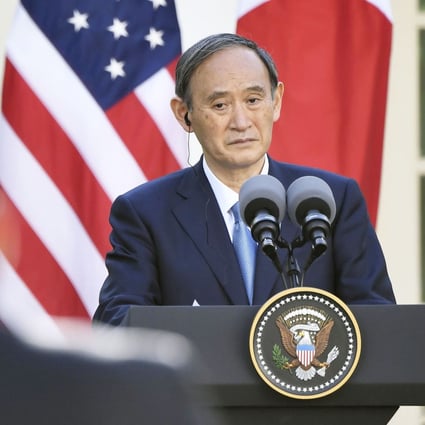 Japanese Prime Minister Yoshihide Suga listens to a question from a reporter during a joint press conference with US President Joe Biden at the White House in Washington this month. Photo: Kyodo