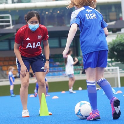 Allyson Shick coaching for the Hong Kong Football Club Junior Soccer programme. Coaches and parents say it is great to see their kids back engaged in sport. Photo: Winson Wong