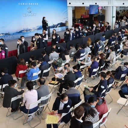 Buyers lining up at the sales office of CK Asset’s Sea To Sky project in Lohas Park at the developer’s sales office at the Metropolis in Hung Hom on March 6, 2021. Photo: Dickson Lee